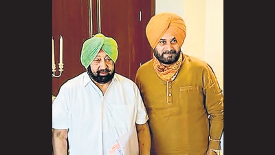 Punjab CM Captain Amarinder Singh with State Congress Chief Navjot Singh Sidhu (PTI) Punjab CM Captain Amarinder Singh with State Congress Chief Navjot Singh Sidhu (PTI)