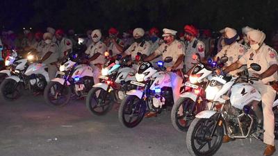 Cops geared up for the mock drill in Ludhiana late on Tuesday. (Harsimar Pal Singh/HT)