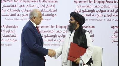 US Special Representative for Afghanistan Reconciliation Zalmay Khalilzad (L) and Taliban co-founder Mullah Abdul Ghani Baradar (R) shake hands after signing the peace agreement between US, Taliban, in Doha, Qatar on February 29, 2020. (File photo) US Special Representative for Afghanistan Reconciliation Zalmay Khalilzad (L) and Taliban co-founder Mullah Abdul Ghani Baradar (R) shake hands after signing the peace agreement between US, Taliban, in Doha, Qatar on February 29, 2020. (File photo)