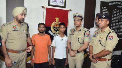 Amritsar police commissioner Vikram Jeet Duggal and DCP Mukhwinder Singh Bhullar handing over the boy to his family in Amritsar on Wednesday. (HT Photo) Amritsar police commissioner Vikram Jeet Duggal and DCP Mukhwinder Singh Bhullar handing over the boy to his family in Amritsar on Wednesday. (HT Photo)