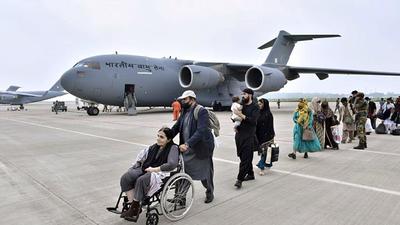 People reach Hindon Air force Station through an IAF flight from Kabul. (ANI Photo) (Ht file)