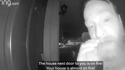 The image taken from the video shows the man banging at the woman's door. (Facebook/@ring)
