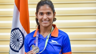 New Delhi: World Athletics U20 Championships Silver medalist long jumper Shaili Singh shows her medal during an interaction with Sports Minister Anurag Thakur in New Delhi, Wednesday, Aug. 25, 2021. (PTI Photo/Manvender Vashist)(PTI08_25_2021_000047A) (PTI) New Delhi: World Athletics U20 Championships Silver medalist long jumper Shaili Singh shows her medal during an interaction with Sports Minister Anurag Thakur in New Delhi, Wednesday, Aug. 25, 2021. (PTI Photo/Manvender Vashist)(PTI08_25_2021_000047A) (PTI)