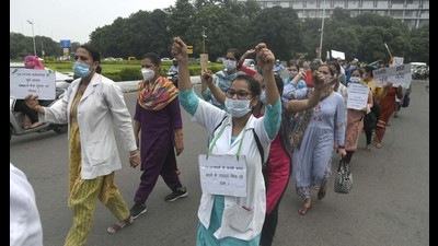 Employees of National Health Mission, Chandigarh, during a protest march on Wednesday. (Keshav Singh/HT)
