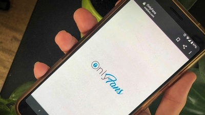 This photo shows a phone app for OnlyFans, a site where fans pay creators for their photos and videos, (AP)