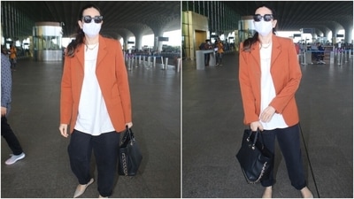 Karisma teamed the jacket with an oversized white printed T-shirt. The way she layered the baggy fits together turned her simple outfit glam. We are taking notes. (HT Photo/Varinder Chawla)