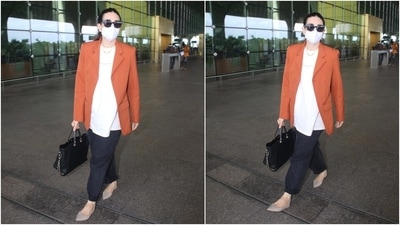 Karisma completed her ensemble by wearing high-waisted black-coloured mom denims. She folded the hems of the pants to give it a trendy touch. She looked effortlessly chic in the outfit. (HT Photo/Varinder Chawla)