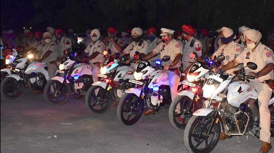 Cops geared up for the mock drill in Ludhiana late on Tuesday. (Harsimar Pal Singh/HT)