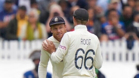 England's Joe Root, right, and England's Jos Buttler. (AP)