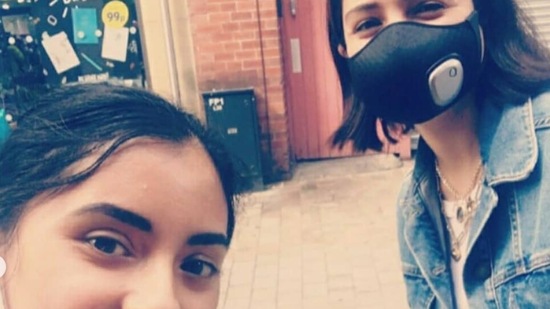 Anushka Sharma poses for a selfie with a fan.