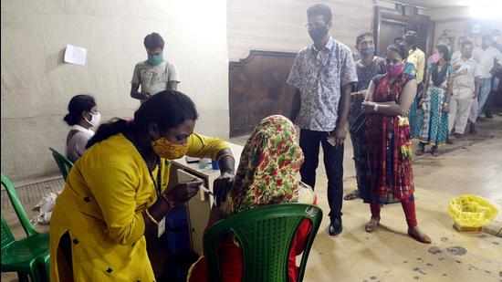 A beneficiary receives a dose of Covid-19 vaccine during a vaccination drive at a cinema hall in Kolkata on Tuesday, August 24. (ANI)