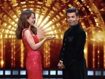 Kangana Ranaut and Karan Johar share the stage at a reality show. Kangana Ranaut and Karan Johar share the stage at a reality show.