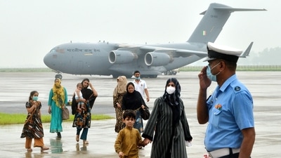 People arrive at Hindon Air force Station through an IAF flight from Kabul at Ghaziabad on Sunday. (ANI/file photo)