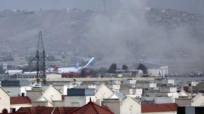 Smoke rises from a deadly explosion outside the airport in Kabul, Afghanistan on Thursday. (AP PHOTO)