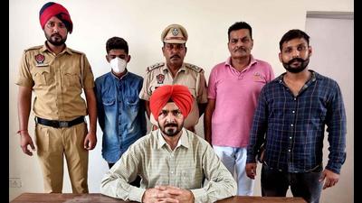The accused in STF custody in Ludhiana on Thursday. (Harsimar Pal Singh/HT)