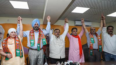 J&K BJP President Ravinder Raina and BJP National General Secretary Tarun Chugh in Jammu. (PTI) J&K BJP President Ravinder Raina and BJP National General Secretary Tarun Chugh in Jammu. (PTI)