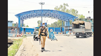 A security personnel patrols outside Jammu Air Force Station after the drone blasts, in Jammu (ANI) A security personnel patrols outside Jammu Air Force Station after the drone blasts, in Jammu (ANI)