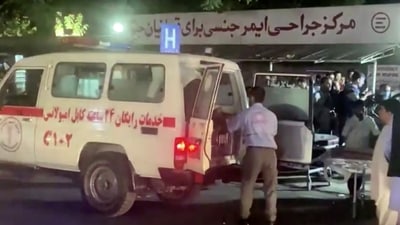 A screen grab shows an emergency vehicle as people arrive at a hospital after an attack at Kabul airport, in Kabul, Afghanistan. (REUTERS)