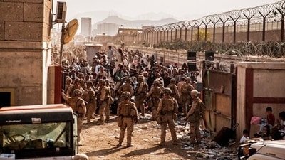 US Marines provide assistance during an evacuation at Hamid Karzai International Airport, Kabul, Afghanistan. (AP / File) US Marines provide assistance during an evacuation at Hamid Karzai International Airport, Kabul, Afghanistan. (AP / File)