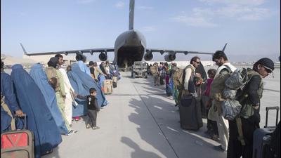 US Air Force loadmasters and pilots assigned to the 816th Expeditionary Airlift Squadron load people being evacuated from Afghanistan onto a US Air Force C-17 Globemaster III at Hamid Karzai International Airport in Kabul, Afghanistan. (AP) US Air Force loadmasters and pilots assigned to the 816th Expeditionary Airlift Squadron load people being evacuated from Afghanistan onto a US Air Force C-17 Globemaster III at Hamid Karzai International Airport in Kabul, Afghanistan. (AP)