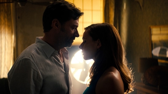 This image released by Warner Bros Pictures shows Hugh Jackman, left, and Rebecca Ferguson in a scene from Reminiscence.(AP) This image released by Warner Bros Pictures shows Hugh Jackman, left, and Rebecca Ferguson in a scene from Reminiscence.(AP)