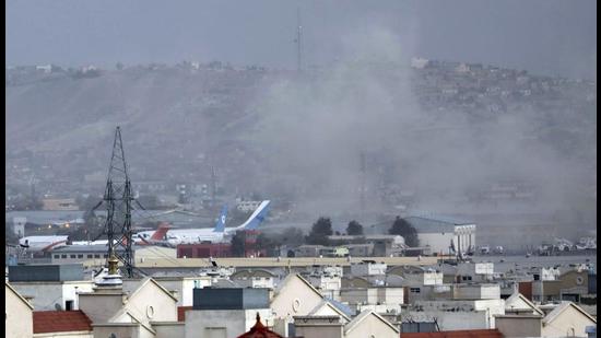 Smoke rises from a deadly explosion outside the airport in Kabul, Afghanistan, on Thursday. (AP)