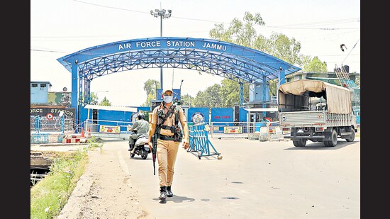 A security personnel patrols outside Jammu Air Force Station after the drone blasts, in Jammu (ANI)