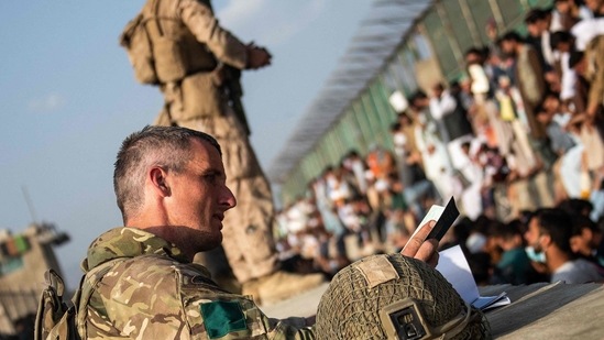 A handout picture released by the British Ministry of Defence on August 24, 2021, and taken on August 22, 2021, shows members of the UK Armed Forces during the operation to support the evacuation of British nationals and entitled personnel at Kabul airport in Afghanistan. (AFP) A handout picture released by the British Ministry of Defence on August 24, 2021, and taken on August 22, 2021, shows members of the UK Armed Forces during the operation to support the evacuation of British nationals and entitled personnel at Kabul airport in Afghanistan. (AFP)