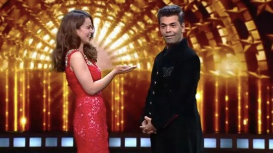 Kangana Ranaut and Karan Johar share the stage at a reality show.