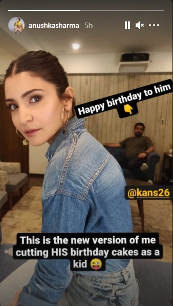 Anushka Sharma posed for the camera as Karnesh sat behind her in a room.
