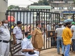 Police personnel deployed at the emergency gate of NRS Hospital where three teachers are admitted. The teachers attempted suicide on Tuesday, in Kolkata. (PTI Photo.) Police personnel deployed at the emergency gate of NRS Hospital where three teachers are admitted. The teachers attempted suicide on Tuesday, in Kolkata. (PTI Photo.)