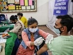 A health worker administers a Covid-19 vaccine shot to a man at an inoculation centre on DDU Marg in New Delhi. A health worker administers a Covid-19 vaccine shot to a man at an inoculation centre on DDU Marg in New Delhi.