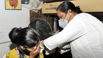 A beneficiary reacts while receiving a dose of Covid-19 vaccine in Guwahati on Thursday, August 26. (ANI)