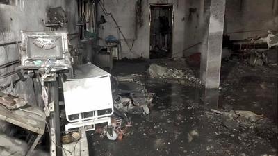 Fire breaks out in Patel Welfare Covid Hospital at midnight and paramedics rescue Covid patients, on May 1, 2021. (PTI) Fire breaks out in Patel Welfare Covid Hospital at midnight and paramedics rescue Covid patients, on May 1, 2021. (PTI)