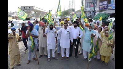 Farmers union members protesting near the venue of BJP meeting in Ludhiana on Tuesday.