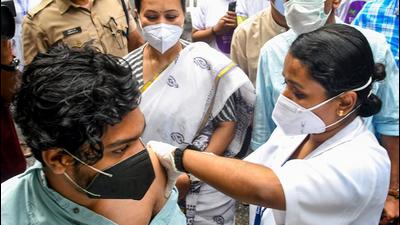 Thiruvananthapuram: A medic administers a dose of Covid-19 vaccine to a beneficiary in the presence of Kerala Minister for Health Veena George, during State's first drive-through vaccination, at Government Womens college in Thiruvananthapuram, Thursday, August 19, 2021. (PTI Photo)(PTI08_19_2021_000048B) (PTI)