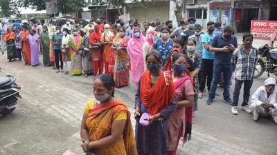 People wait for their turn to get vaccinated against Covid-19 in Lucknow on Friday. (Deepak Gupta/HT Photo)