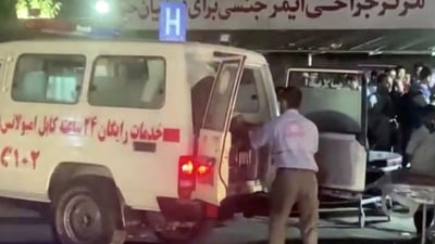 A screen grab shows an emergency vehicle as people arrive at a hospital after an attack at Kabul airport, in Kabul, Afghanistan on August 26, 2021. (Via Reuters. )