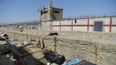 A suitcase and backpacks of Afghan people who were waiting to be evacuated are seen at the site of the August 26 twin suicide bombs, which killed scores of people including 13 US troops, at Kabul airport on August 27, 2021. (Wakil Kohsar / AFP) A suitcase and backpacks of Afghan people who were waiting to be evacuated are seen at the site of the August 26 twin suicide bombs, which killed scores of people including 13 US troops, at Kabul airport on August 27, 2021. (Wakil Kohsar / AFP)