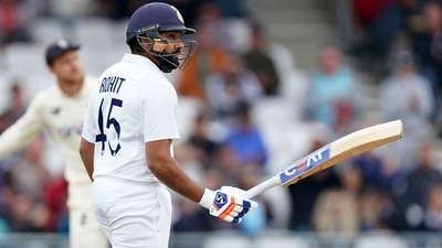 India's Rohit Sharma raises his bat to celebrate scoring fifty runs during the third day of third Test (AP) India's Rohit Sharma raises his bat to celebrate scoring fifty runs during the third day of third Test (AP)
