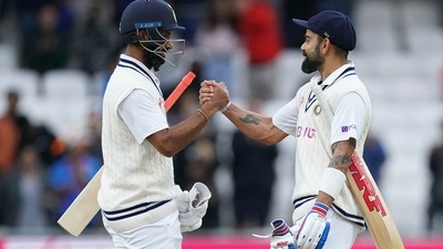India captain Virat Kohl (R) and Cheteshwar Pujara celebrate at the end of play on the third day of third Test (AP) India captain Virat Kohl (R) and Cheteshwar Pujara celebrate at the end of play on the third day of third Test (AP)