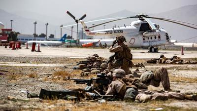 US Marines keep watch during an evacuation at Hamid Karzai International Airport, Kabul, Afghanistan. (REUTERS) US Marines keep watch during an evacuation at Hamid Karzai International Airport, Kabul, Afghanistan. (REUTERS)