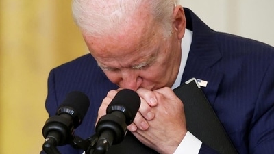 US President Joe Biden listens to a question from a member of the media as he delivers remarks about Afghanistan, from the East Room of the White House in Washington, DC. US President Joe Biden listens to a question from a member of the media as he delivers remarks about Afghanistan, from the East Room of the White House in Washington, DC.