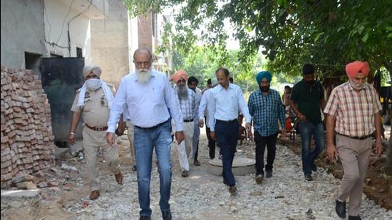 LIT chairman Raman Balasubramaniam and MC officials to carry out checking of under construction roads in block G-40 of Shaheed Bhagat Singh Nagar in Ludhiana on Friday. (HT PHOTO)