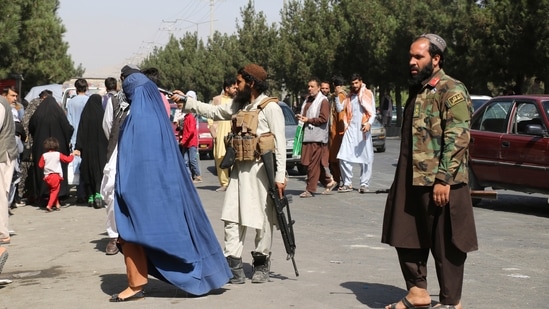 Due to the security concerns in the Kabul international airport, Brennan said that it would not be suitable for the supply of aid in Afghanistan. In picture - Taliban fighters stand guard outside the airport.(AP)