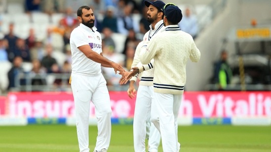 India's Mohammed Shami celebrates with teammates after taking the wicket of England's Craig Overton