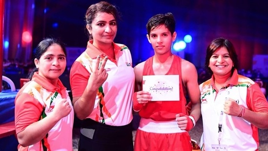 India's junior boxer Vishu Rathee poses with coaches India's junior boxer Vishu Rathee poses with coaches