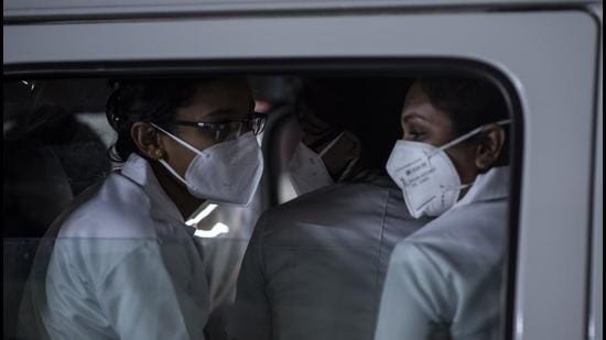 Health workers leave in an ambulance after a Covid-19 vaccination drive at a shopping mall in Kochi, Kerala on Friday. (AP PHOTO.)