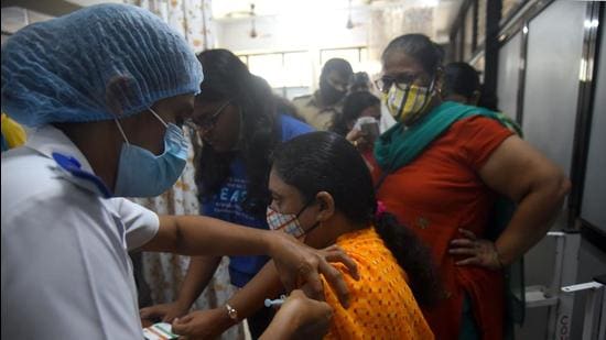 Beneficiaries in the above-18 age group get inoculated against Covid-19 at Bharatratna Dr. Babasaheb Ambedkar Municipal General Hospital, Kandivali. (HT PHOTO)