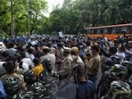 Security personnel and demonstrators seen during a protest against communal hatred at Jantar Mantar, in New Delhi. Security personnel and demonstrators seen during a protest against communal hatred at Jantar Mantar, in New Delhi.